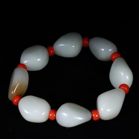 A white jade bracelet made of Hetian jade seed