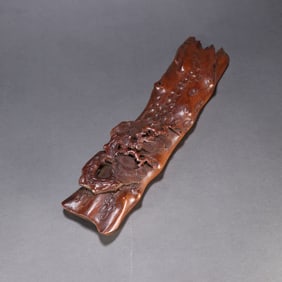 A Qing Dynasty bamboo carving "Pine and Cypress Evergreen" armrest