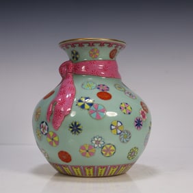 A Qing Dynasty pastel gold-painted group flower ribbon bottle