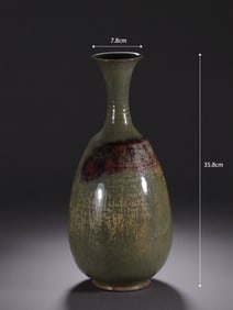 A silver mouth bottle wrapped in Jun porcelain