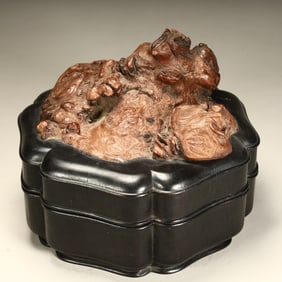 A Qing Dynasty rosewood inlaid gall with a shaped lid box