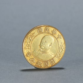 A silver-gilt commemorative one-yuan coin