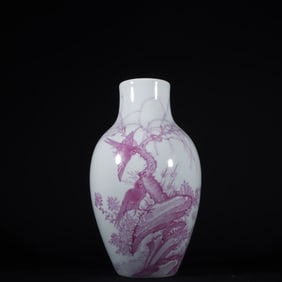 A Qing Dynasty Qianlong carmine flower and bird vase
