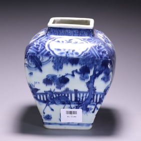 A bright blue and white character story jar