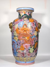 A Qing Dynasty Qianlong enamel color Kowloon kaleidoscope lion's ear donggua bottle