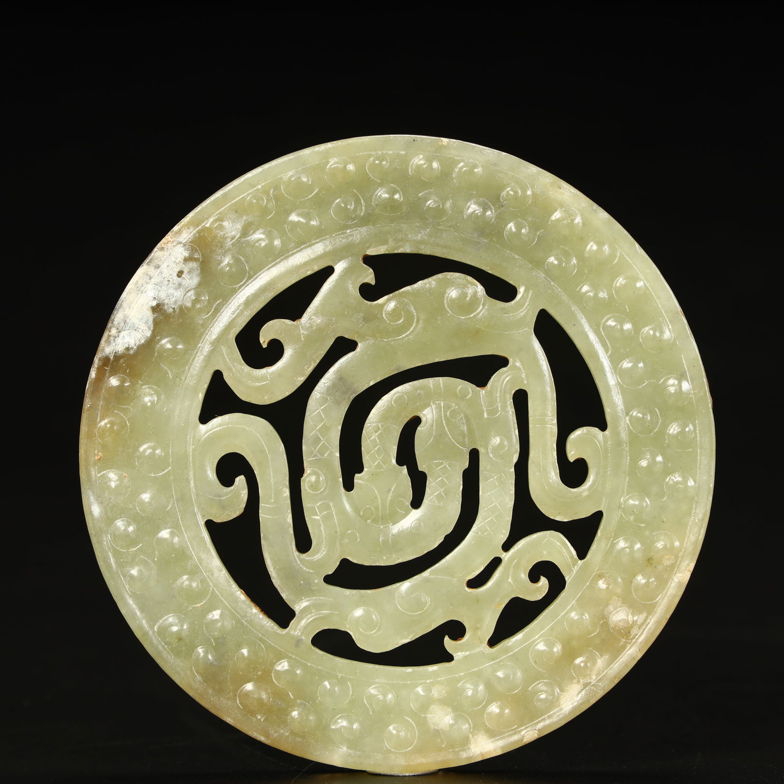 A Han Dynasty hollow dragon valley pattern jade (1 of 8)