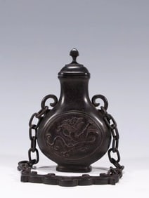A Qing Dynasty small-leaved rosewood with a chain appreciation bottle