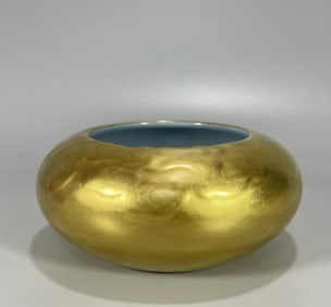 A pair of Qing Dynasty Yongzheng bean celadon carvings and gold ground washing