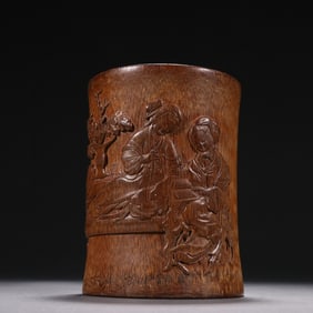 A Qing Dynasty Wu Zhifan bamboo carved maid reading pen holder