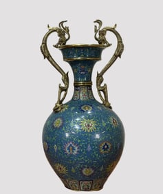 A Qing Dynasty cloisonné enamel royal blue ground entwined lotus double dragon ear bottle