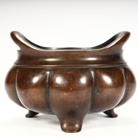 A Qing Dynasty copper bridge ear melon ridge three-legged incense burner