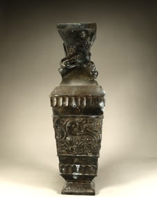 A Qing Dynasty bronze dragon pattern square bottle