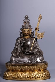 A seated statue of Qing Dynasty copper-gilt gilt silver lotus peanut