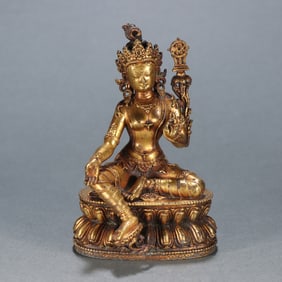 A Qing Dynasty bronze gilt green Tara statue