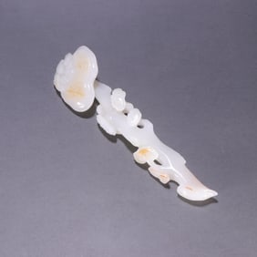 A Qing Dynasty Hetian jade seed material Ganoderma lucidum ruyi handle