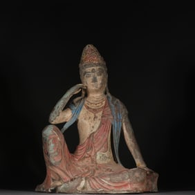 A bronze colored Guanyin statue