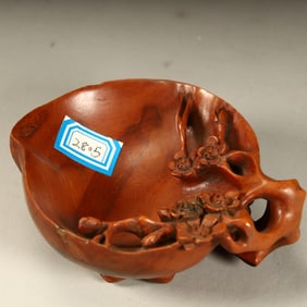 A Qing Dynasty boxwood carving plum pattern pen wash