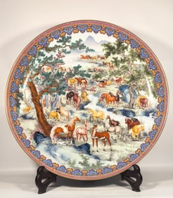 A Qing Dynasty Qianlong enamel color hundred horse plates