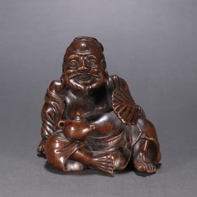 A Qing Dynasty agarwood figure ornament