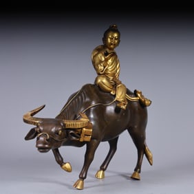 A Qing Dynasty copper gilt boy herding cattle ornament