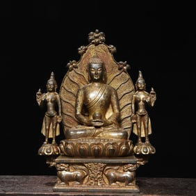 A statue of one Buddha and two disciples of the Northern Wei Dynasty in copper clay