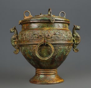 A Western Zhou bronze double dragon round jar