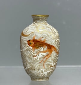 A Qianlong alum red gold-painted fish snuff bottle