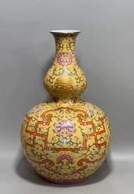 A Qing Dynasty Qianlong enamel colorful yellow ground gourd bottle