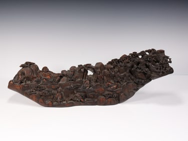 A boxwood carving boy plays Maitreya