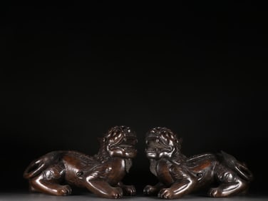 A pair of Qing Dynasty agarwood beast ornaments