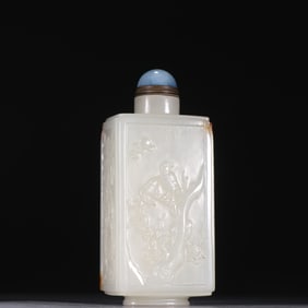 A Qing Dynasty Hetian jade flower and bird pattern snuff bottle