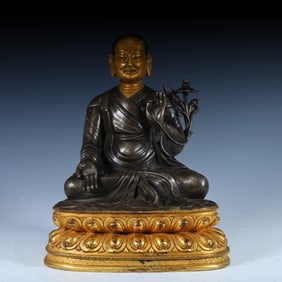 A bronze partially gilded statue of the guru in the Qing Dynasty