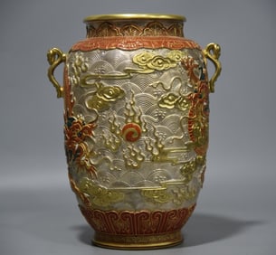 A Qing Dynasty silver ground ruyi winter melon bottle