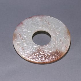 A Qing Dynasty Hetian jade dragon and phoenix pattern