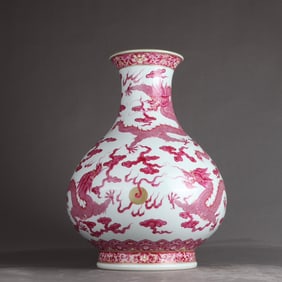 A Qing Dynasty Qianlong enamel carmine red five-dragon bead vase