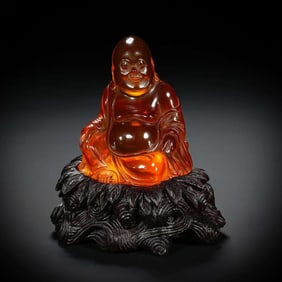 A carving of an amber Maitreya Bodhisattva in the Qing Dynasty