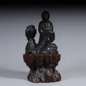 A seated statue of a seated agarwood maid in the Qing Dynasty (with a seat)