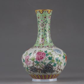 A Qing Dynasty Qianlong pastel gold-painted flower appreciation vase