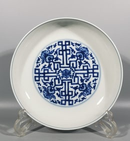 A Qing Dynasty Yongzheng blue and white entwined lotus pattern swastika pattern longevity peach