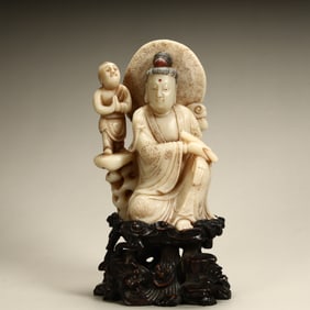 A statue of Guanyin boy carved in stone from Shoushan
