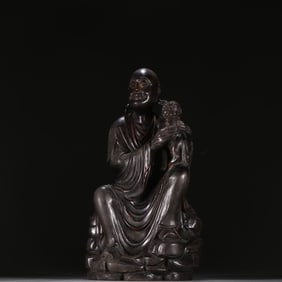 A Qing Dynasty rosewood arhat ornament