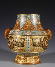 A Qing Dynasty Qianlong elephant ear carved gold ground Futong