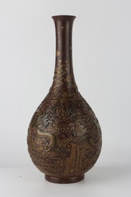 A Qing Dynasty Qianlong imitation bronze carved dragon pattern vase