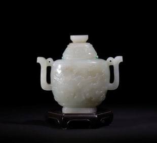 A Qing Dynasty blue and white jade carved gluttonous pattern amphora stationery