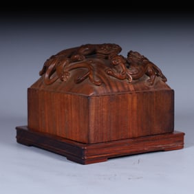 A Qing Dynasty Huanghuali wood carved dragon tiger seal