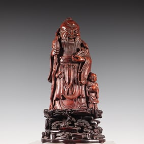 A Qing Dynasty bamboo carving boy birthday celebration paper weightweight study ornament