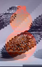 A red and yellow two-color gourd lacquer bottle