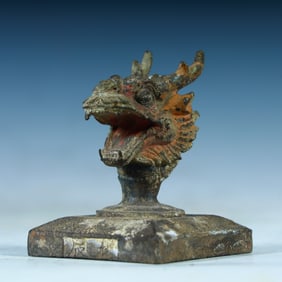 A Tang Dynasty copper painted dragon head seal