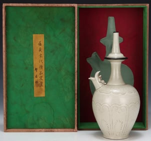 A Song Ding kiln carved flower clean bottle