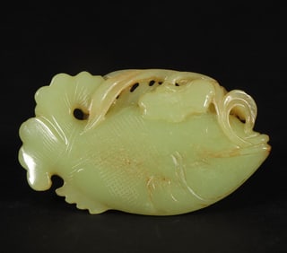 A Qing Dynasty Hetian topaz fish with a lotus